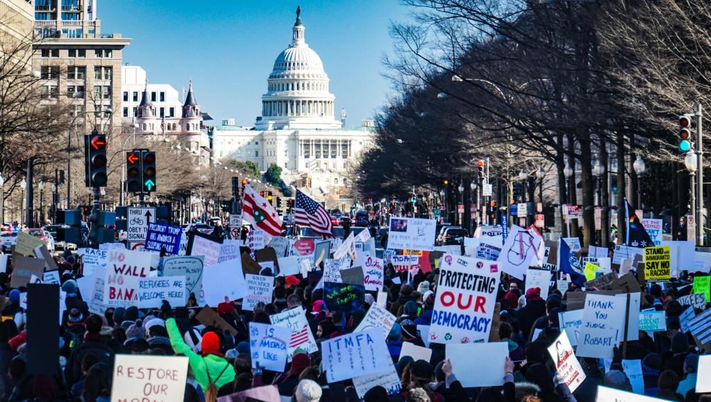 Image of protestors holding banners in Washington DC, USA